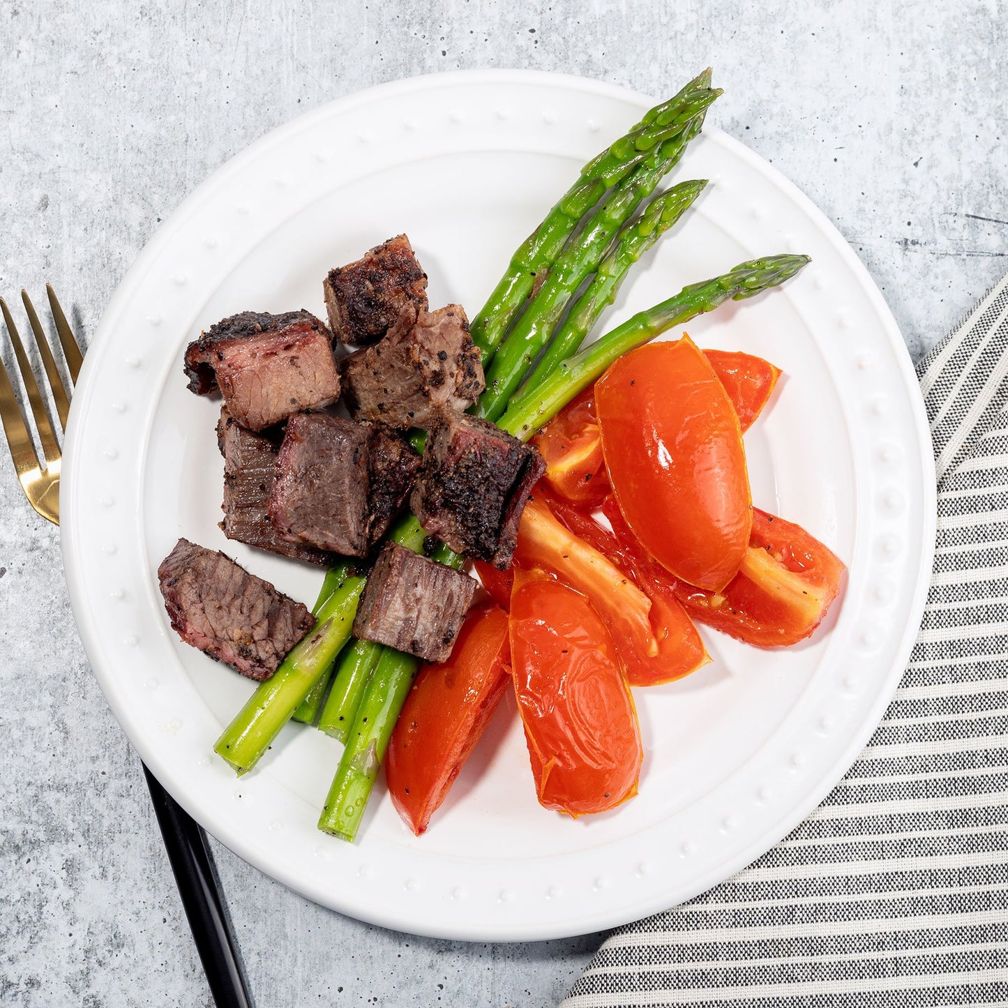 Peppercorn Crusted Brisket with Roasted Tomatoes and Asparagus
