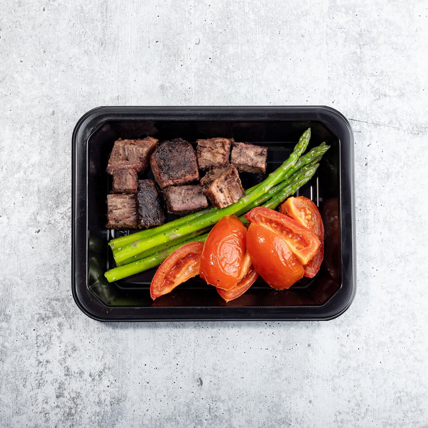 Peppercorn Crusted Brisket with Roasted Tomatoes and Asparagus